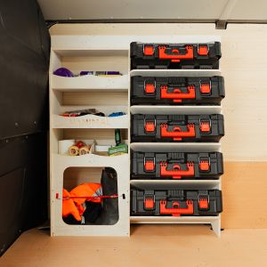 Side van view of the Vauxhall Vivaro C 2019- Front Ulti-Rack Van Racking V2 displaying Milwaukee equipment, tools and boxes