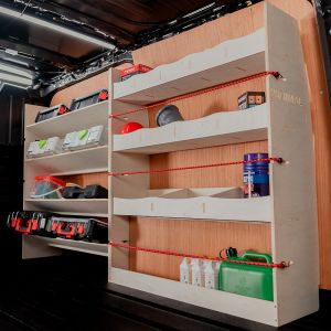 Rear van side angle view of the Nissan Primastar 2001-2014 LWB Full Driver Side Ply Racking with Front Toolbox Shelving