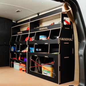 Rear side angle view of the Vauxhall Vivaro B 2014-2019 Hexaboard Driver Side Ulti-Rack Van Racking displaying equipment, tools and boxes